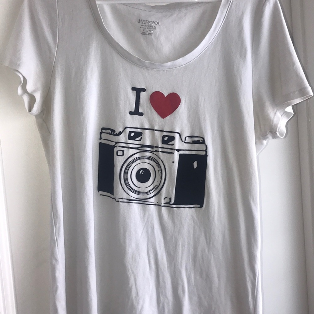 A white T-shirt with a camera